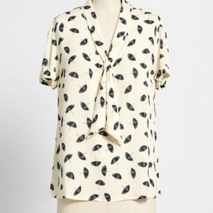 MODCLOTH cream colored cute playful flowy office  blouse in a large